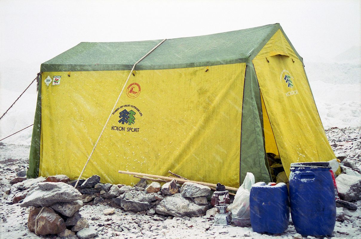 21 Kitchen Tent In Light Snow At Shagring Camp On Upper Baltoro Glacier When I woke the next morning at Shagring camp on the Upper Baltoro Glacier, snow had started to fall on the kitchen tent.